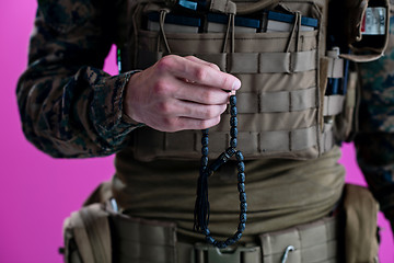 Image showing soldier praying tespih