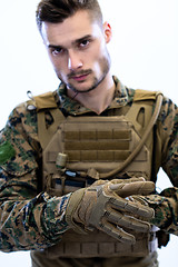 Image showing closeup of soldier hands putting protective battle gloves