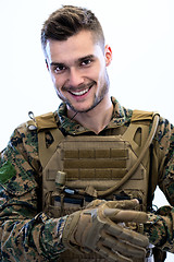 Image showing closeup of soldier hands putting protective battle gloves