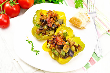 Image showing Pepper stuffed with vegetables in plate on white board