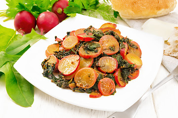 Image showing Radish with spinach and spices in plate on white wooden board