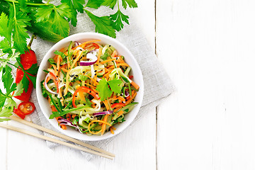 Image showing Salad of cucumber in bowl on board top