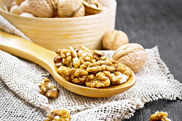 Image showing Walnuts in spoon on dark board