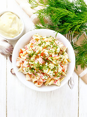 Image showing Salad of surimi and eggs with mayonnaise on light board top