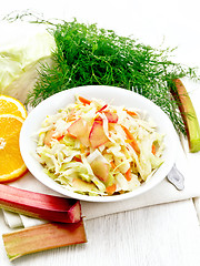 Image showing Salad of cabbage and rhubarb in plate on board