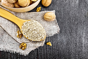 Image showing Flour walnut in spoon on dark board top