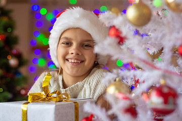Image showing Portrait of a close-up of a beautiful girl with a New Year\'s gift
