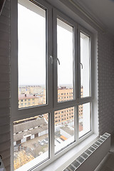 Image showing Stained glass high and wide plastic windows in the apartment