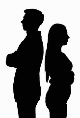 Image showing A silhouetted contoured black white portrait of a young couple standing with their backs to each other