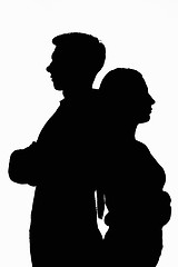 Image showing Dark silhouettes of a young couple on a white background