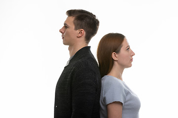 Image showing Portrait of a man and a woman standing with their backs to each other