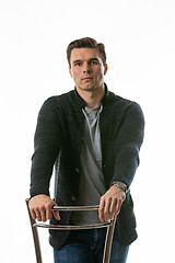 Image showing Portrait of a somewhat sad young man on a white background