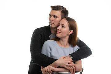 Image showing Portrait of a young couple looking to the left, a white background