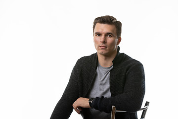 Image showing Portrait of a young man in ordinary clothes, white background