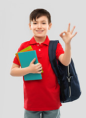 Image showing schoolboy with books and school bag showing ok