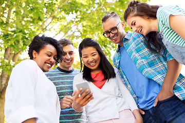 Image showing happy friends with smartphone at summer park