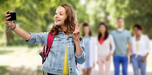 Image showing teenage student girl taking selfie by smartphone