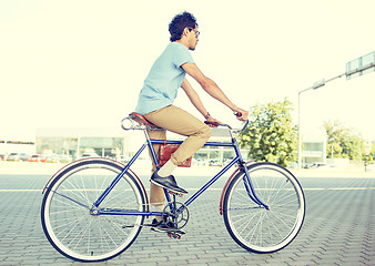 Image showing young hipster man riding fixed gear bike