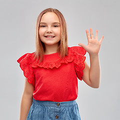 Image showing smiling girl in red shirt showing five fingers