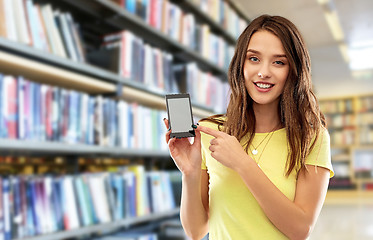 Image showing young woman or teenage girl holding smartphone