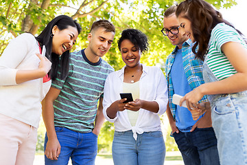 Image showing happy friends with smartphones at summer park