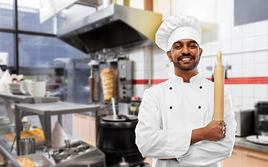 Image showing happy indian chef with rolling-pin at kebab shop