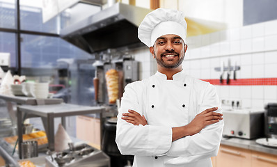 Image showing happy male indian chef in toque at kebab shop