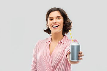 Image showing woman drinking soda from can with paper straw