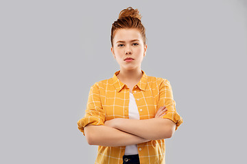 Image showing serious red haired teenage girl with crossed arms