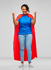 Image showing happy african american woman in superhero red cape