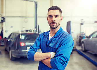 Image showing auto mechanic man or smith at car workshop