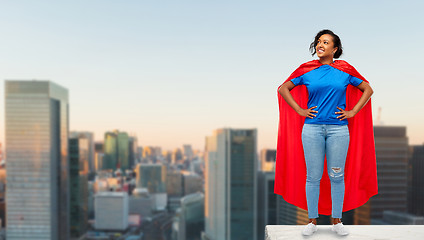 Image showing happy african american woman in superhero red cape