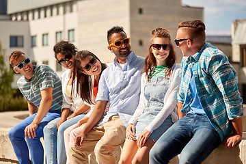 Image showing happy friends in sunglasses at city in summer