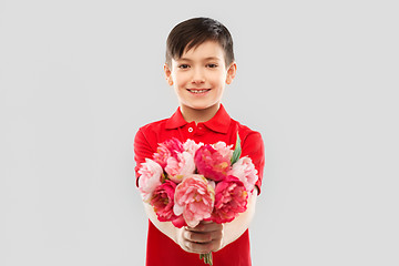 Image showing smiling boy with peony flowers