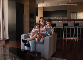 Image showing happy young mother spending time with kids