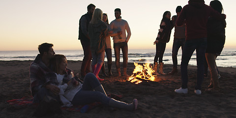 Image showing Friends having fun at beach on autumn day