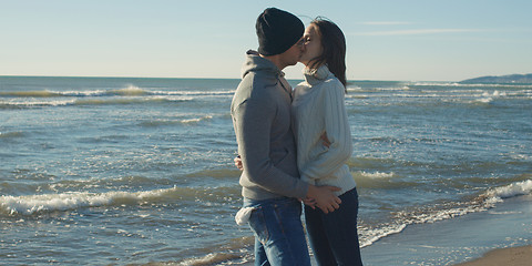 Image showing Couple having fun on beautiful autumn day at beach