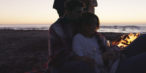 Image showing Friends having fun at beach on autumn day