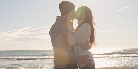 Image showing Couple having fun on beautiful autumn day at beach