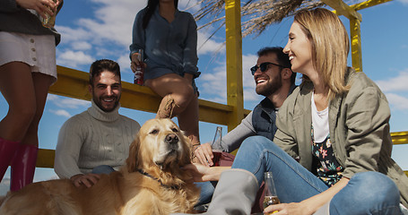 Image showing Group of friends having fun on autumn day at beach