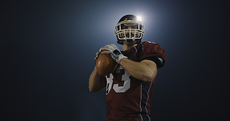 Image showing american football player throwing rugby ball