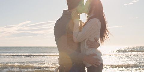 Image showing Couple having fun on beautiful autumn day at beach