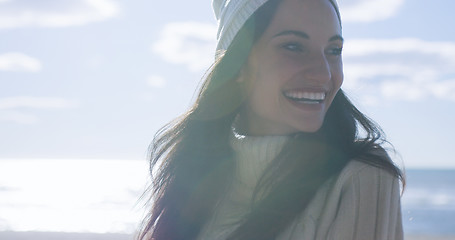 Image showing Girl In Autumn Clothes Smiling on beach