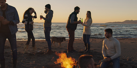 Image showing Friends having fun at beach on autumn day