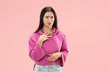 Image showing Beautiful woman looking suprised and bewildered isolated on pink