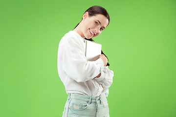 Image showing Businesswoman hugging laptop. Love to computer concept.