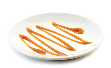 Image showing caramel sauce on white plate