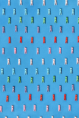 Image showing Colored clothespins pattern on a blue.