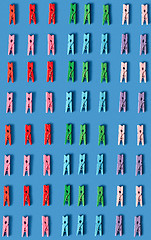 Image showing Vertical multicolored background from clothes pegs.