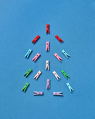 Image showing Christmas tree made from colored clothesrpins.